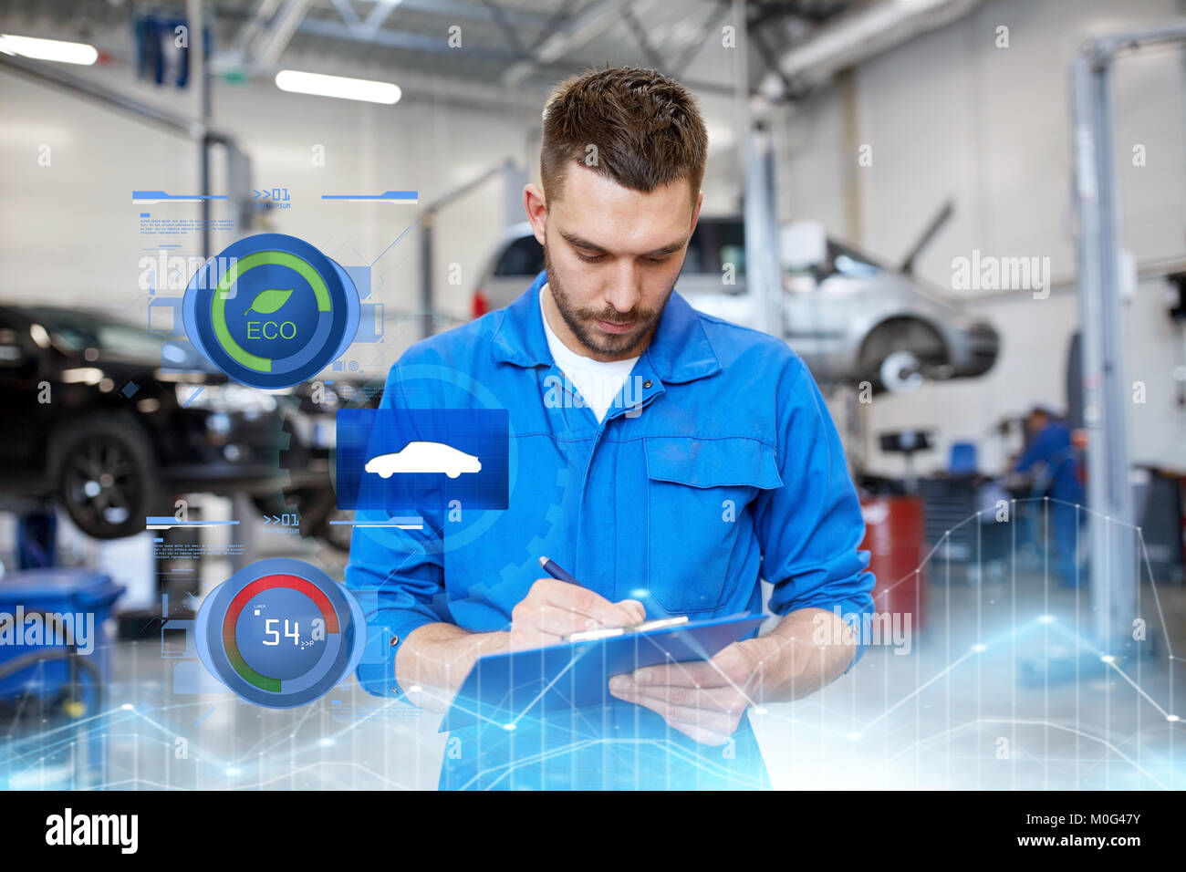 auto mechanic man with clipboard at car workshop Stock Photo