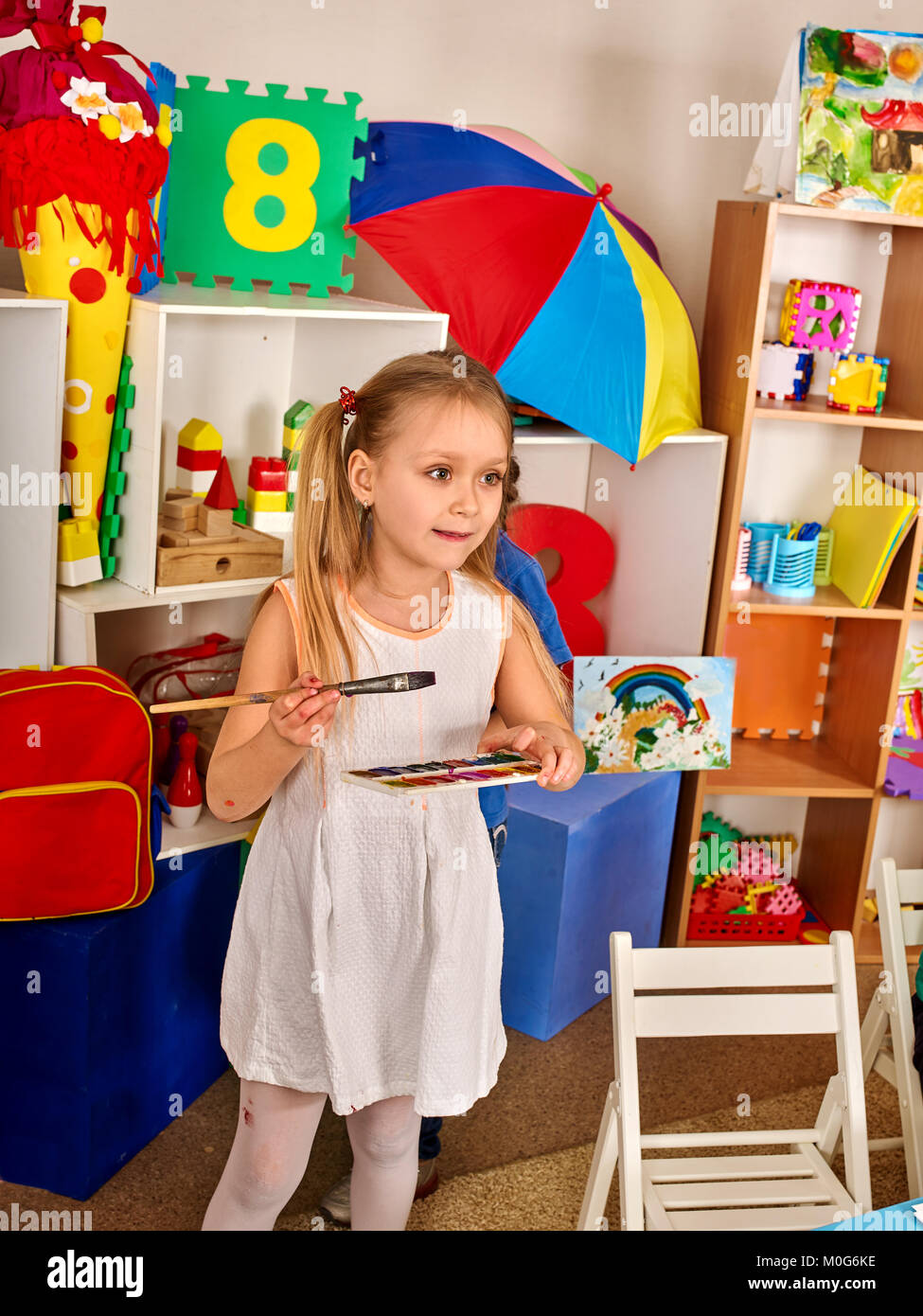 Small students children painting in art school class Stock Photo - Alamy