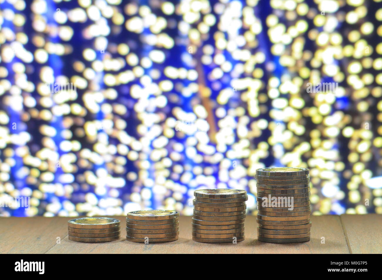 business leadership. Gold coins pile stacked in increasing chart shape ...