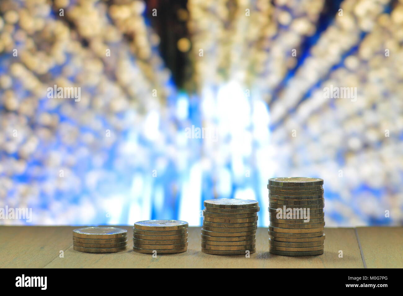 business leadership. Gold coins pile stacked in increasing chart shape ...