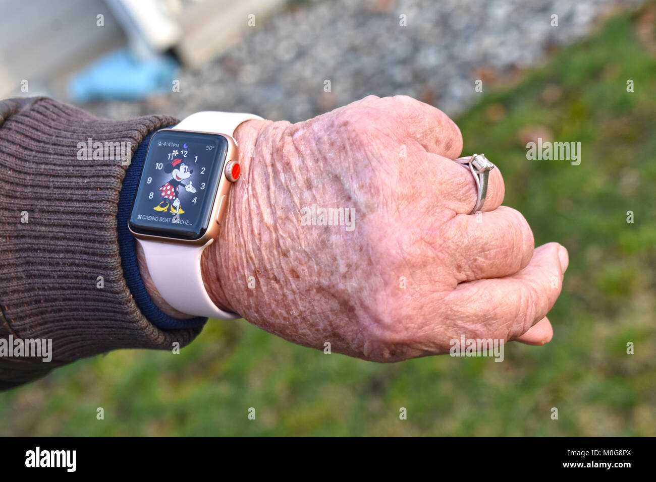 An Apple Watch Series 3 on the wrists of an older woman Stock Photo - Alamy