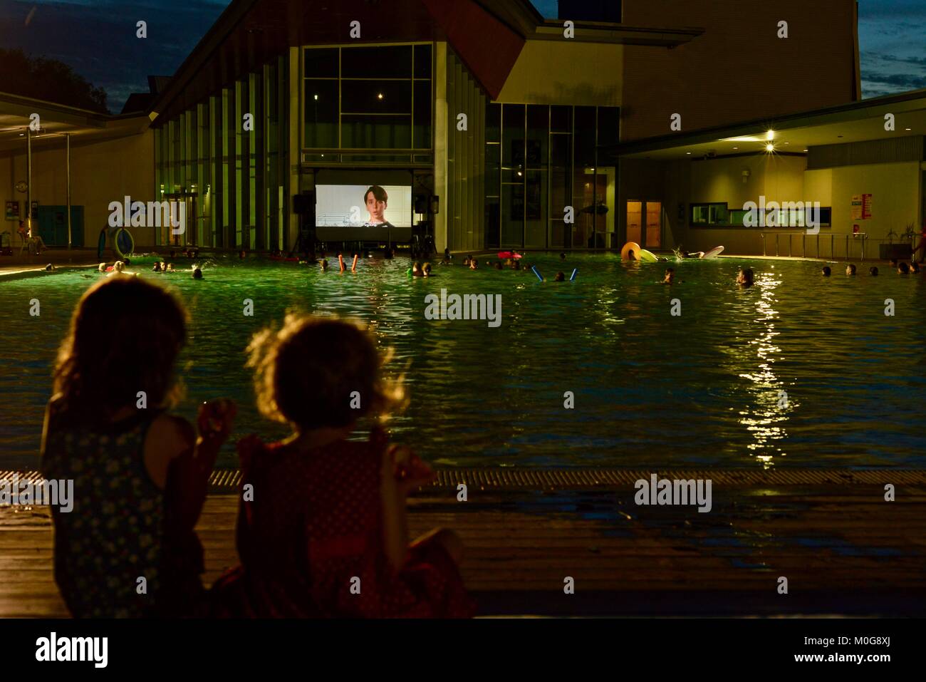 Kids watching a movie at the Riverway pool movie night, Townsville