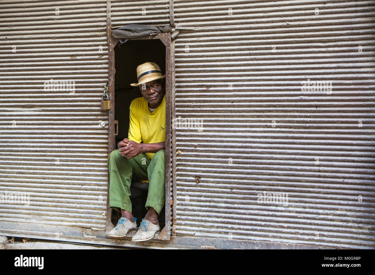 Poor man passing time in Havana, Cuba Stock Photo