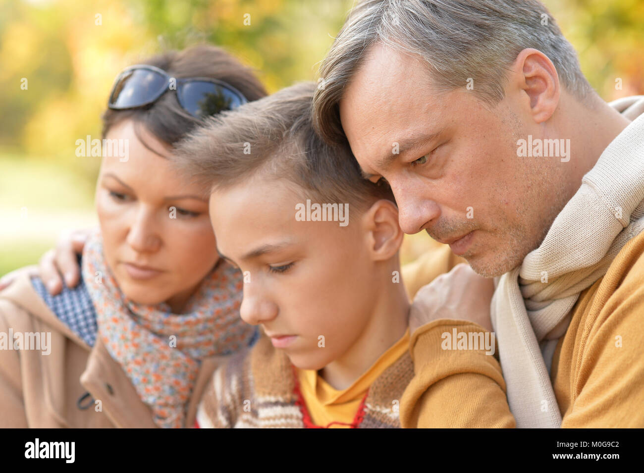 family in the autumn park Stock Photo - Alamy