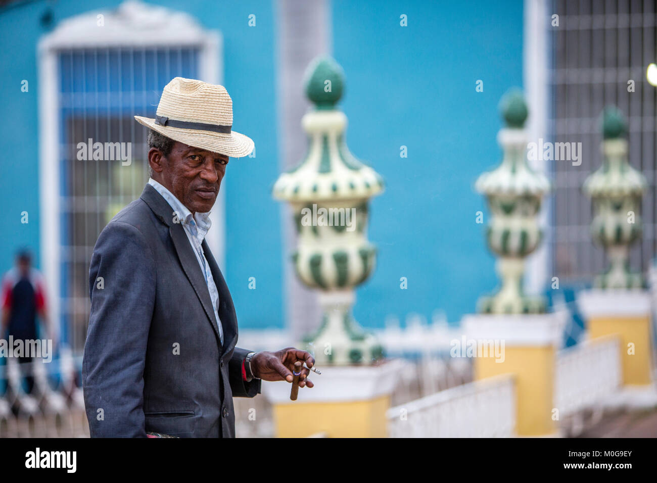 Man wearing Fedora at Plaza Mayor in Trinidad, Cuba Stock Photo