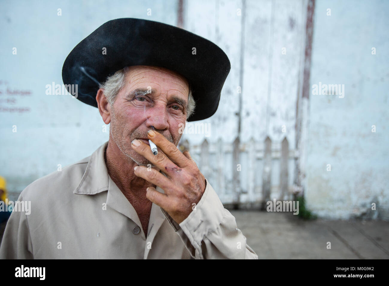 Man passing time smoking in Vinales Valley, Cuba Stock Photo