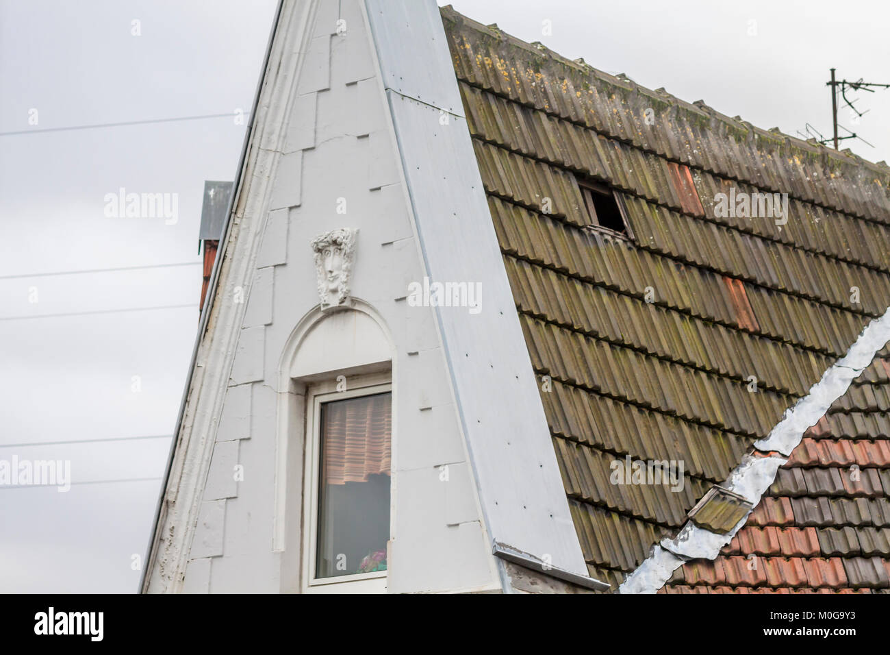 Essen / Germany - January 18 2018 : Storm Friederike has loosened a roof tile in Essen - Schonnebeck Stock Photo