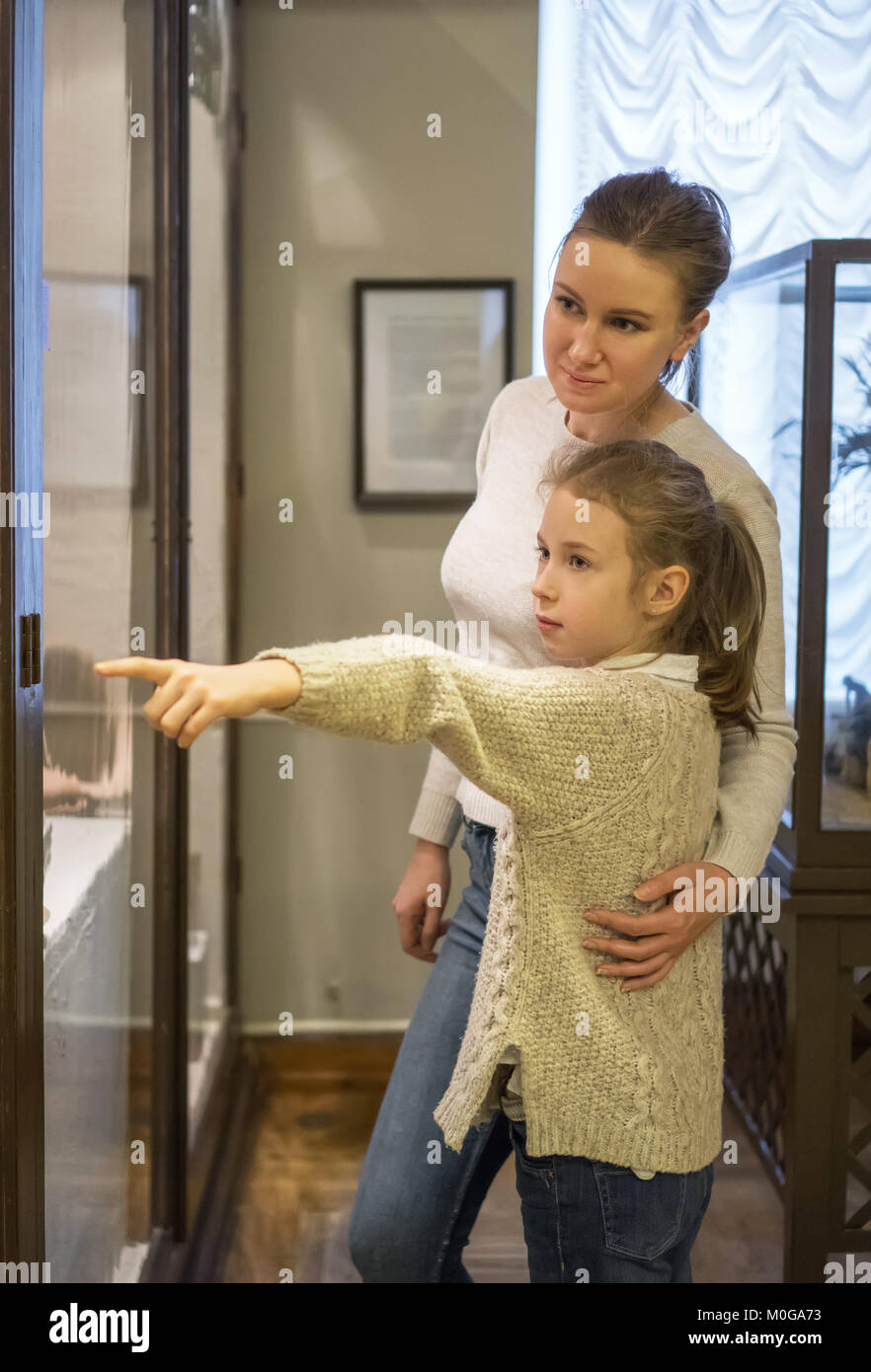 Woman and her daughter exploring expositions in museum Stock Photo - Alamy