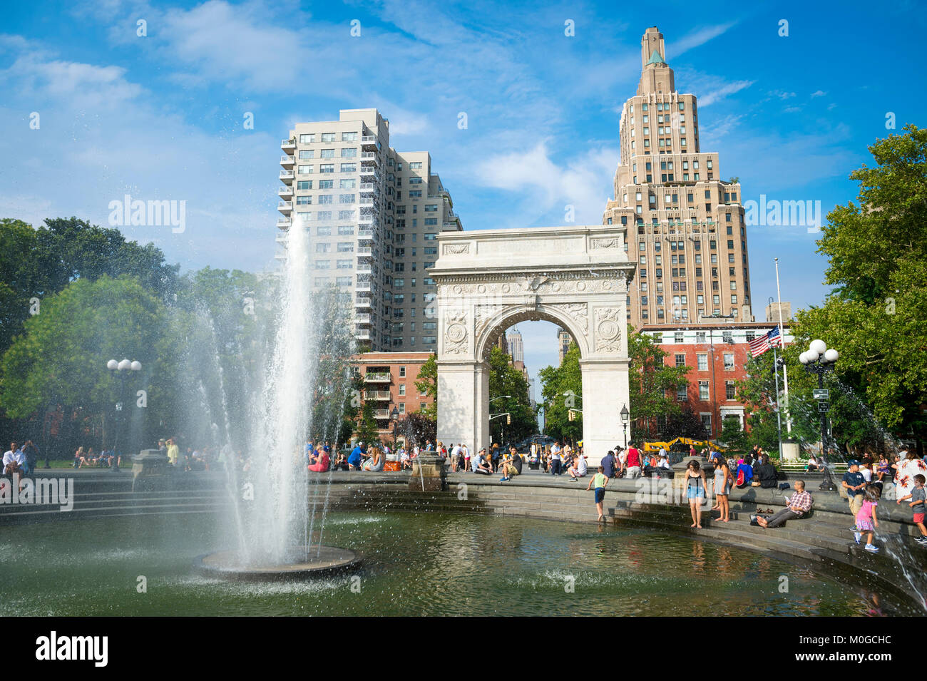 Scenic sunny summer afternoon view of the fountain and arch at Washington Square Park in Greenwich Village, downtown Manhattan, New York City Stock Photo