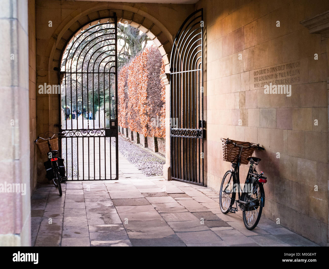 Cambridge Tourism - Student Bike parked in a picturesque gateway in Clare College, part of the University of Cambridge in central Cambridge UK Stock Photo