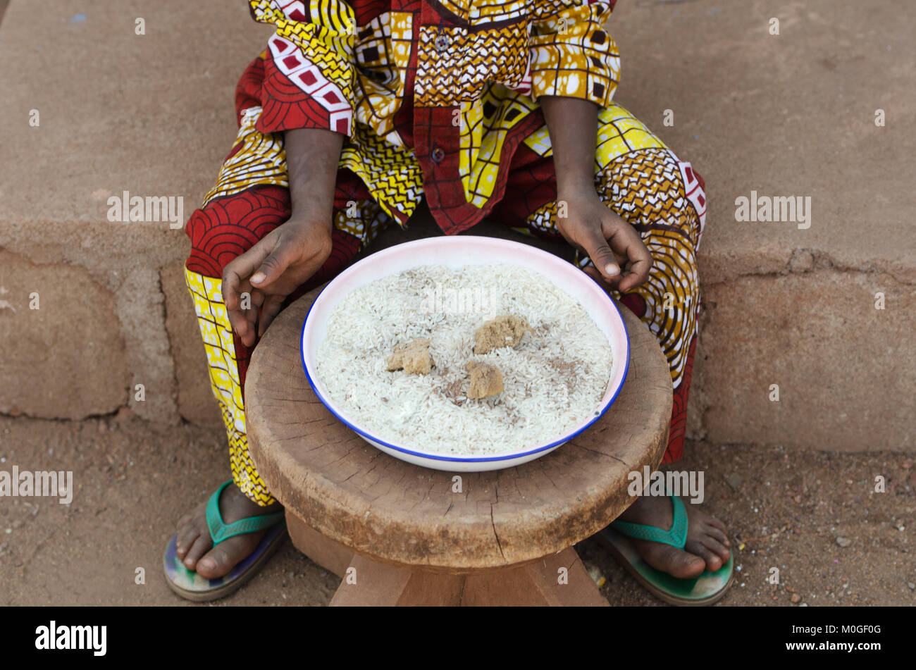 Closeup Shot of Little African Baby Eating Rice Stock Photo