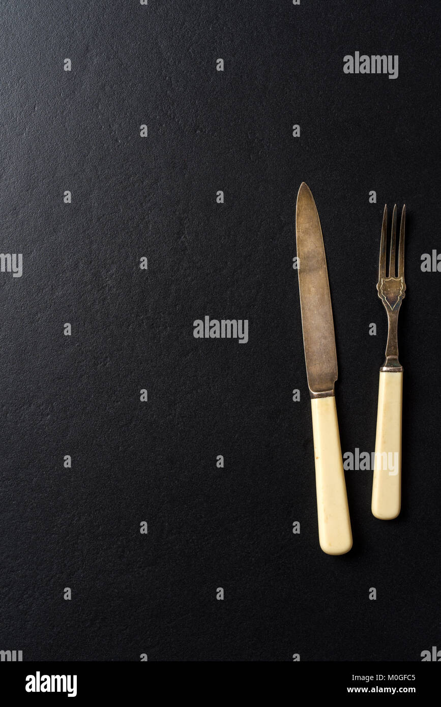 Kitchen utensils over black elegant background Stock Photo - Alamy