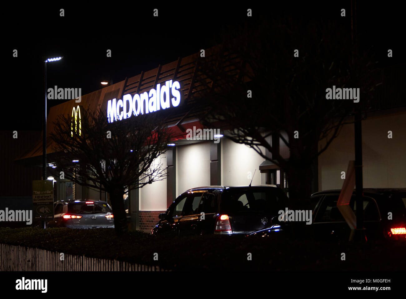 mcdonalds restaurant drive through at night in the uk Stock Photo