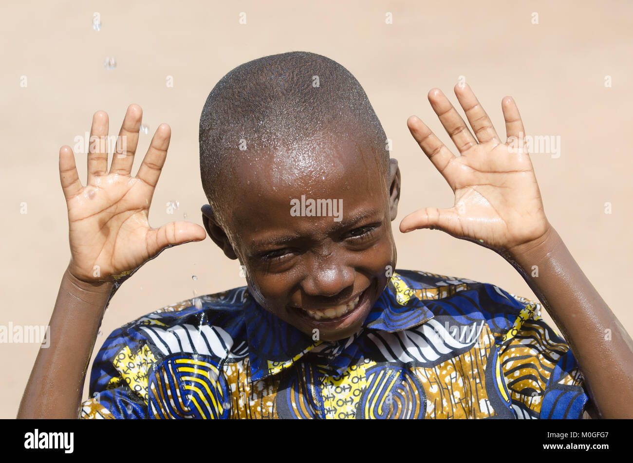 Handsome Young Boy Showing Hands Laughing Outdoors Stock Photo - Alamy