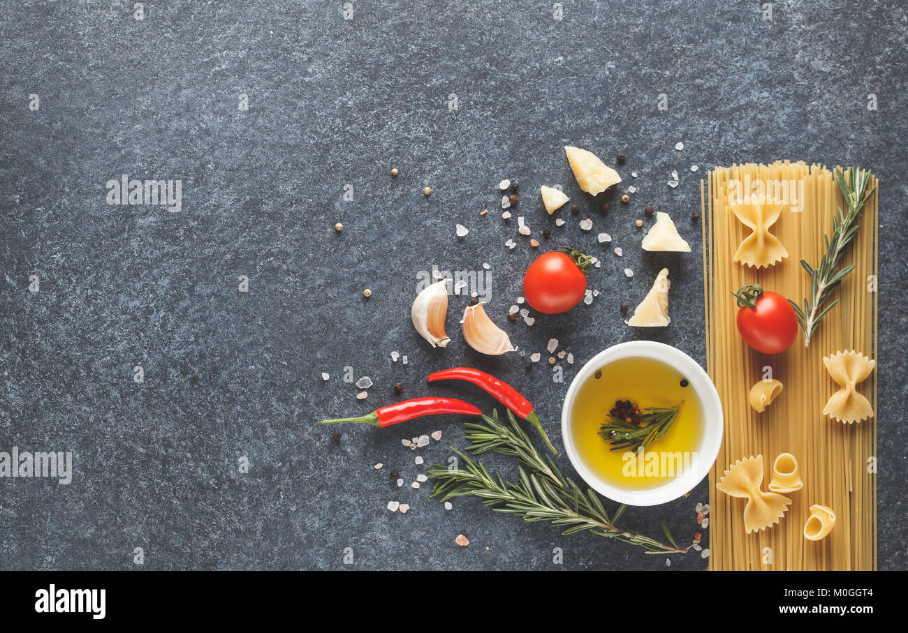 Italian pasta ingredients background. Spaghetti, olive oil, Parmesan