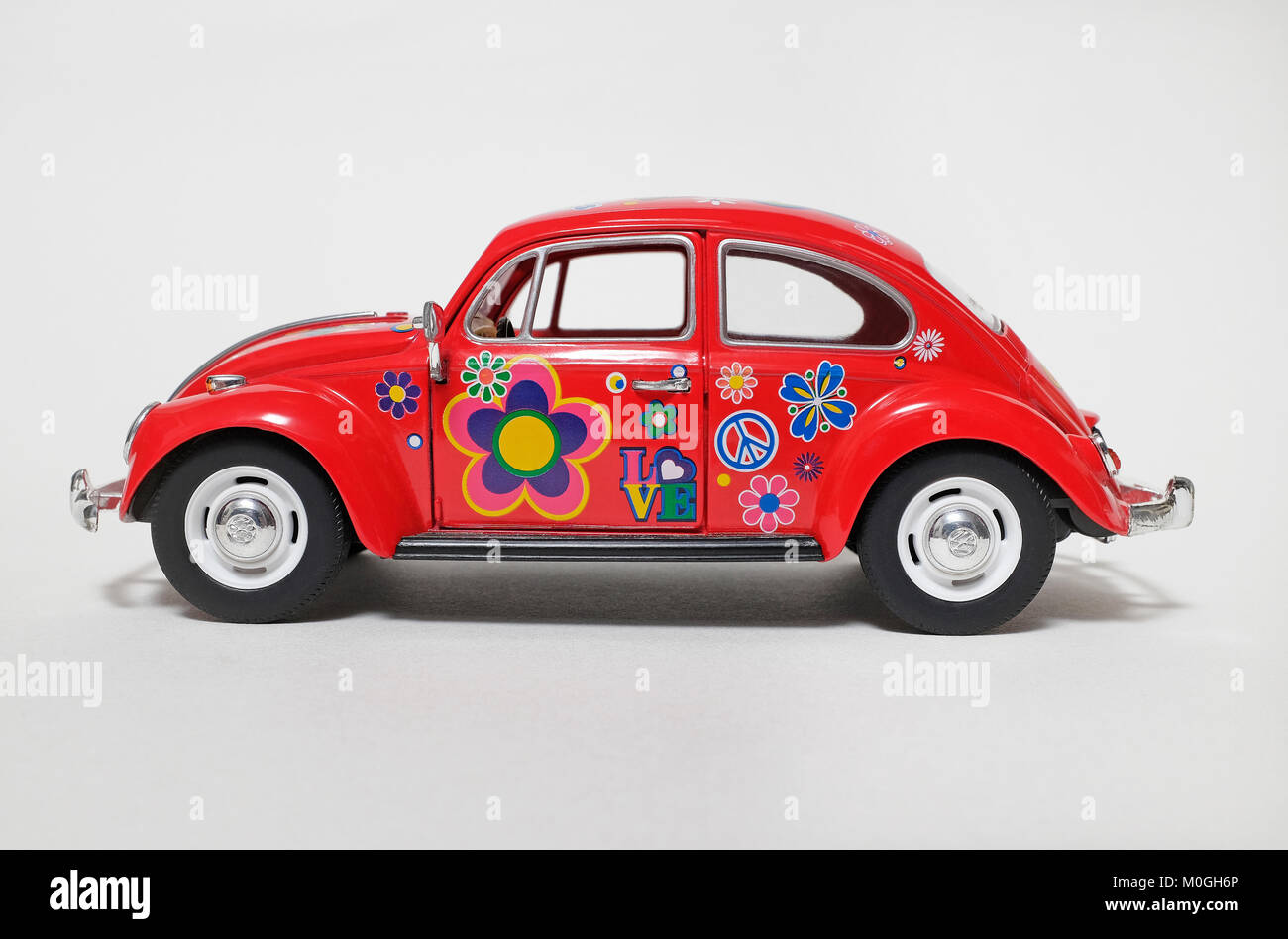 red volkswagen beetle hippy flower power car Stock Photo