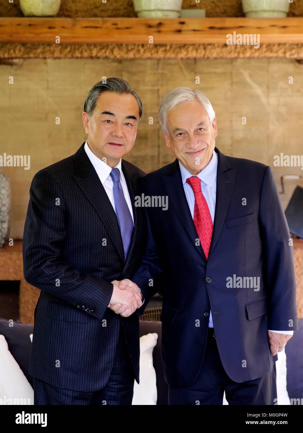 Santiago, Chile. 21st Jan, 2018. Chinese Foreign Minister Wang Yi (L) shakes hands with Chile's president-elect Sebastian Pinera during their meeting in Santiago, Chile, Jan. 21, 2018. Credit: Wang Pei/Xinhua/Alamy Live News Stock Photo