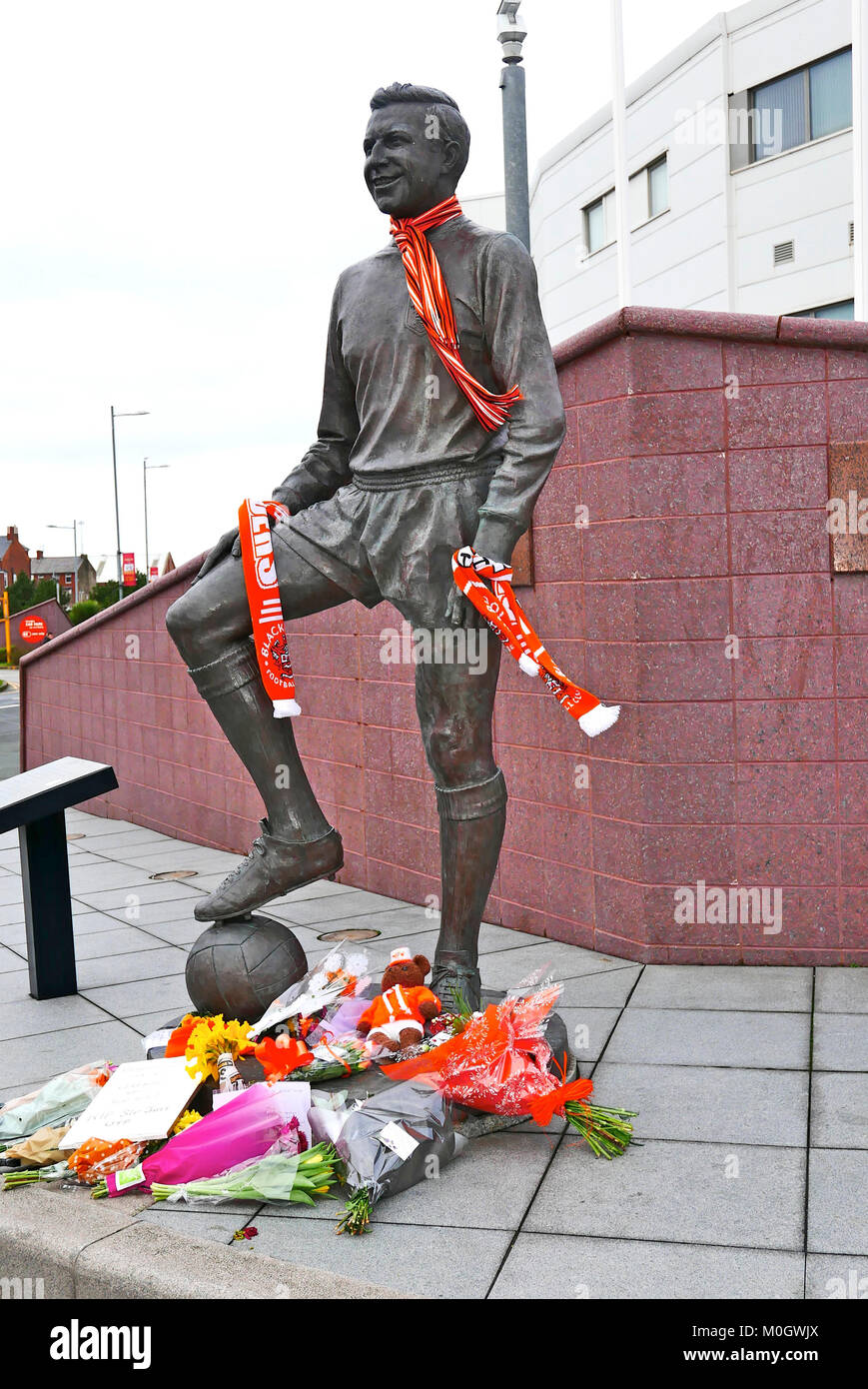 Blackpool, UK. 22nd Jan, 2018. Blackpool fans laid tributes of flowers and scarves on and around the statue of the late Jimmy Armfield CBE in front of Blackpool's Bloomfield Road stadium. Kev Walsh/Alamy Live News Stock Photo