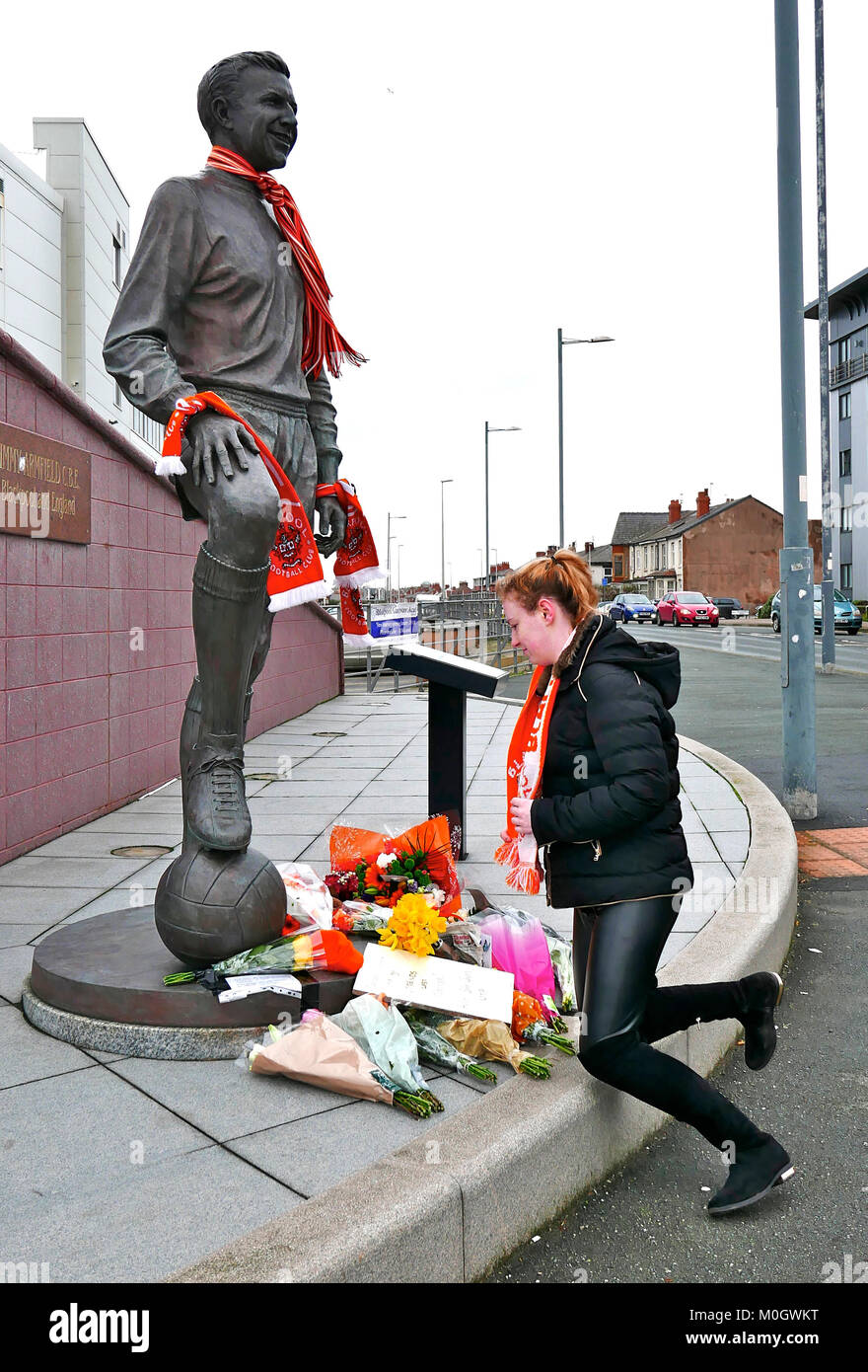 Blackpool, UK. 22nd Jan, 2018. Blackpool fans laid tributes of flowers and scarves on and around the statue of the late Jimmy Armfield CBE in front of Blackpool's Bloomfield Road stadium. Kev Walsh/Alamy Live News Stock Photo