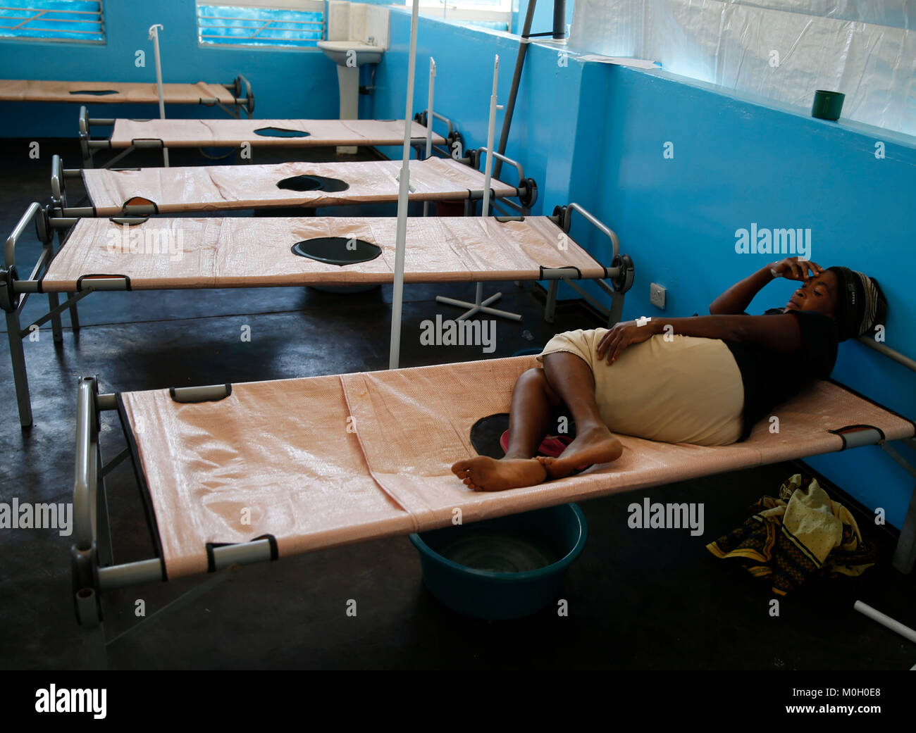 Cholera patient rests on bed hires stock photography and images Alamy