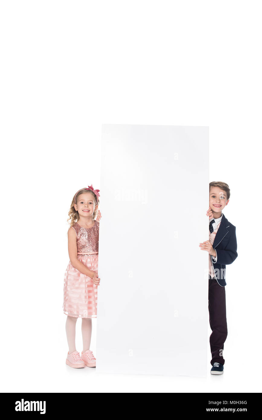 adorable smiling children holding blank banner and smiling at camera ...