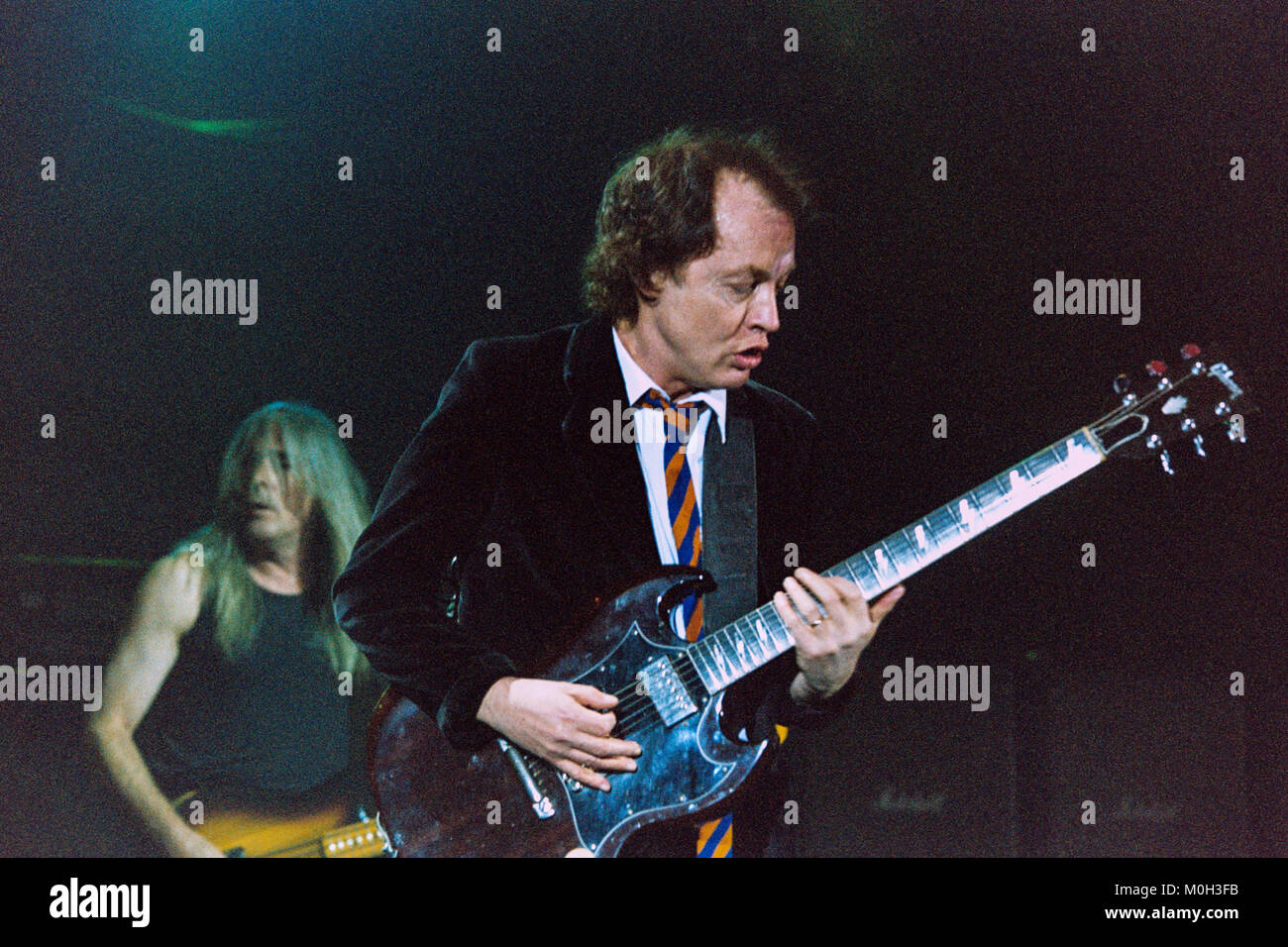 Angus Young of Australian Rock group AC/DC performing at the Hammersmith Apollo. 21st October 2003, London, England, United Kingdom. Stock Photo