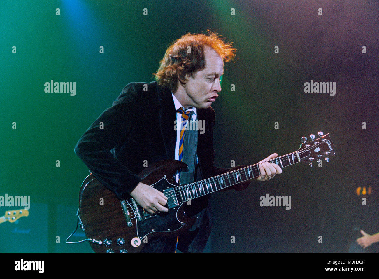 Angus Young of Australian Rock group AC/DC performing at the Hammersmith Apollo. 21st October 2003, London, England, United Kingdom. Stock Photo