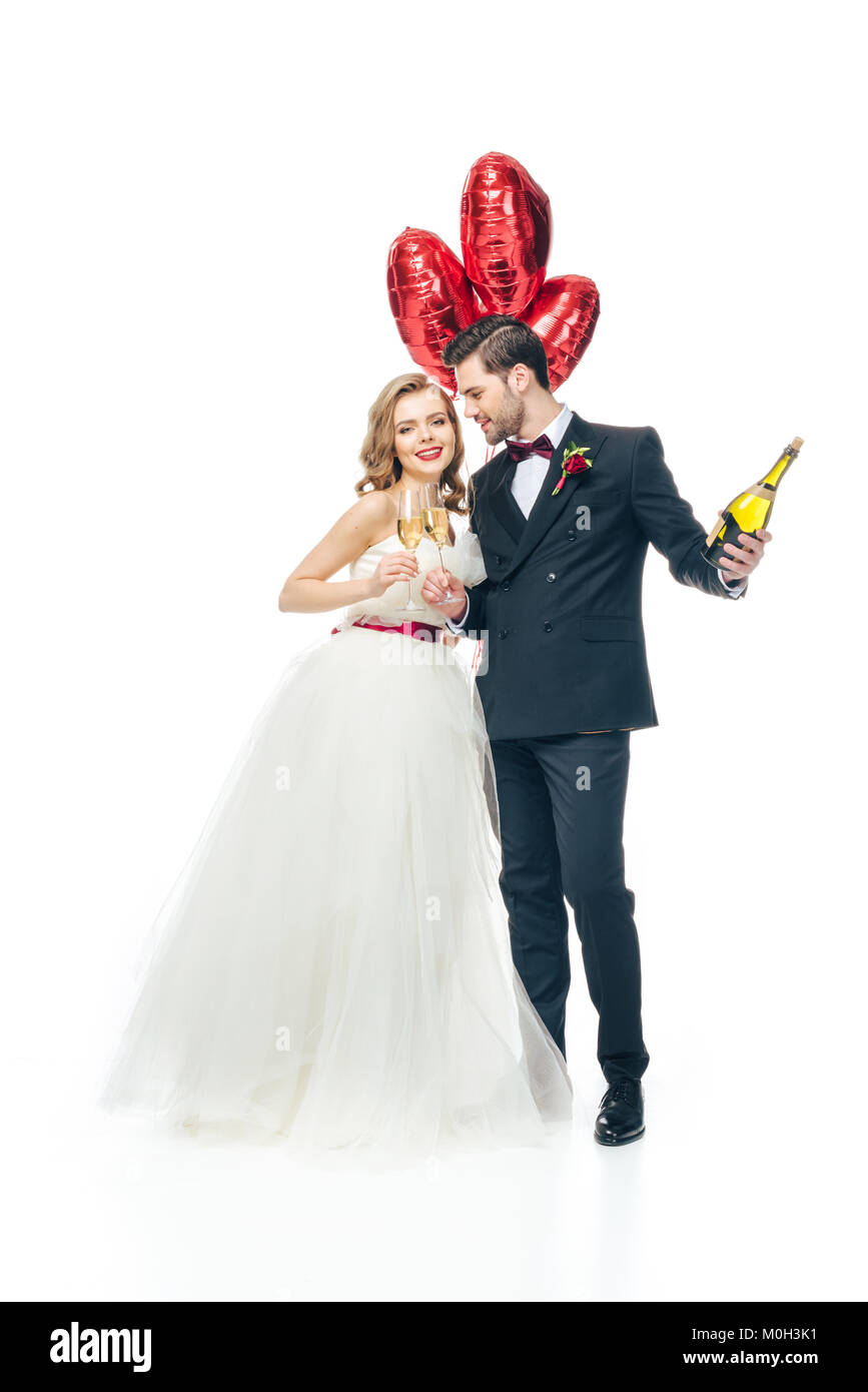 wedding couple with red heart shaped balloons and champagne isolated on ...