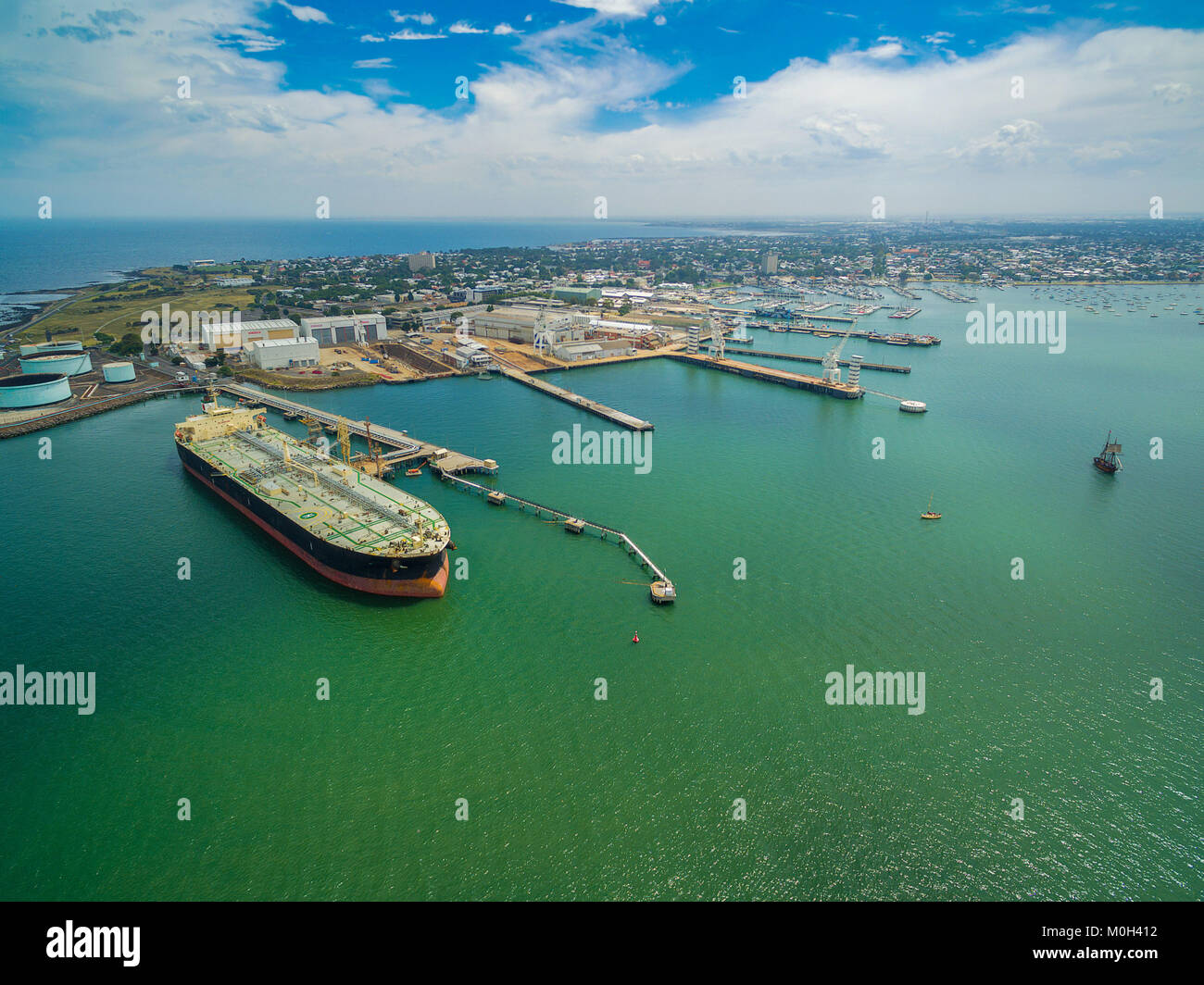 Aerial view of oil tanker moored at industrial port. Williamstown