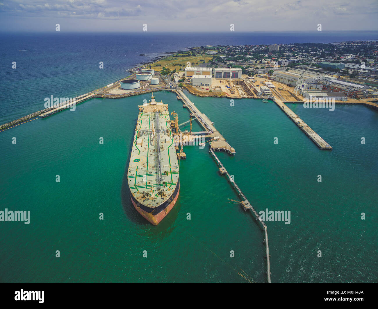Aerial landscape of oil tanker moored at industrial port. Williamstown, Victoria, Australia Stock Photo