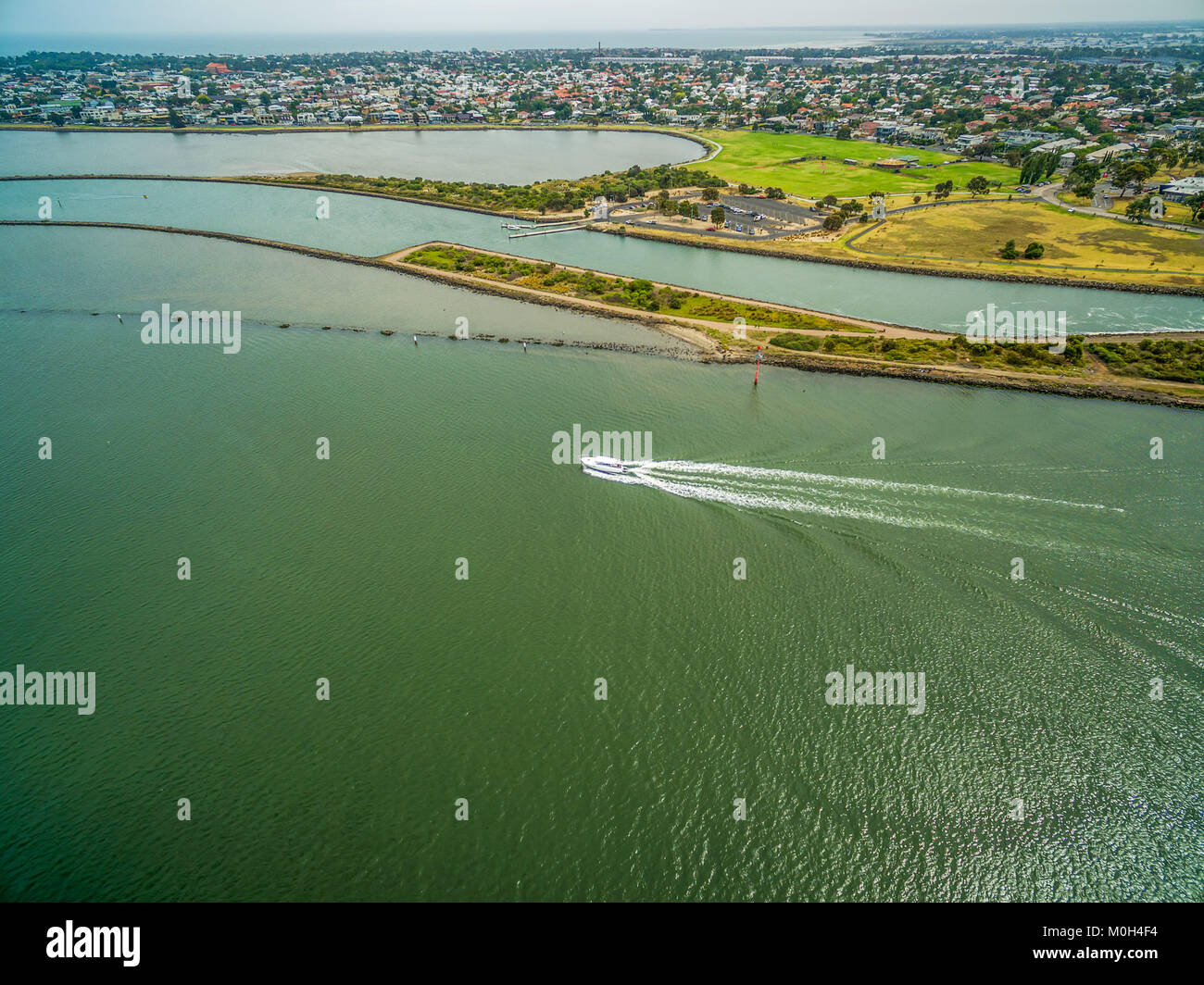 Aerial view of boat sailing out of Yarra river mouth in Melbourne