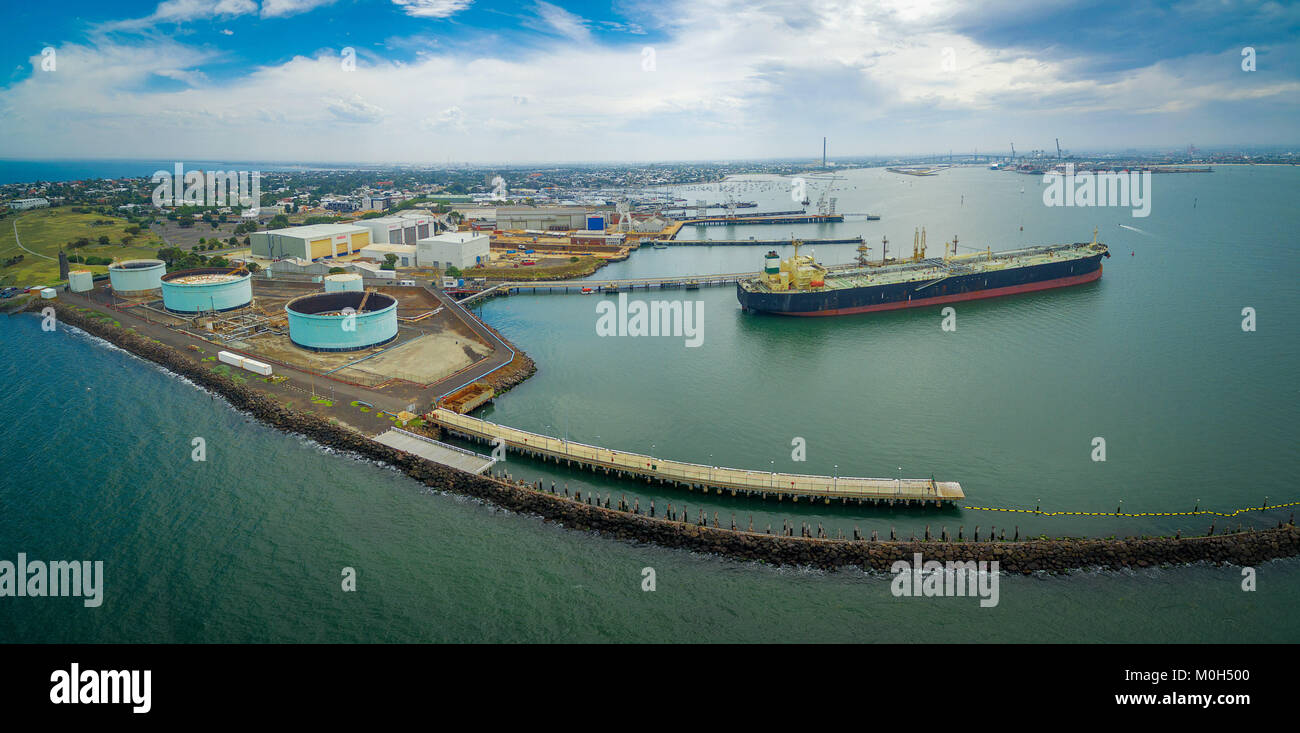 Aerial panorama of large industrial nautical vessel moored at docks in Williamstown, Melbourne, Australia Stock Photo