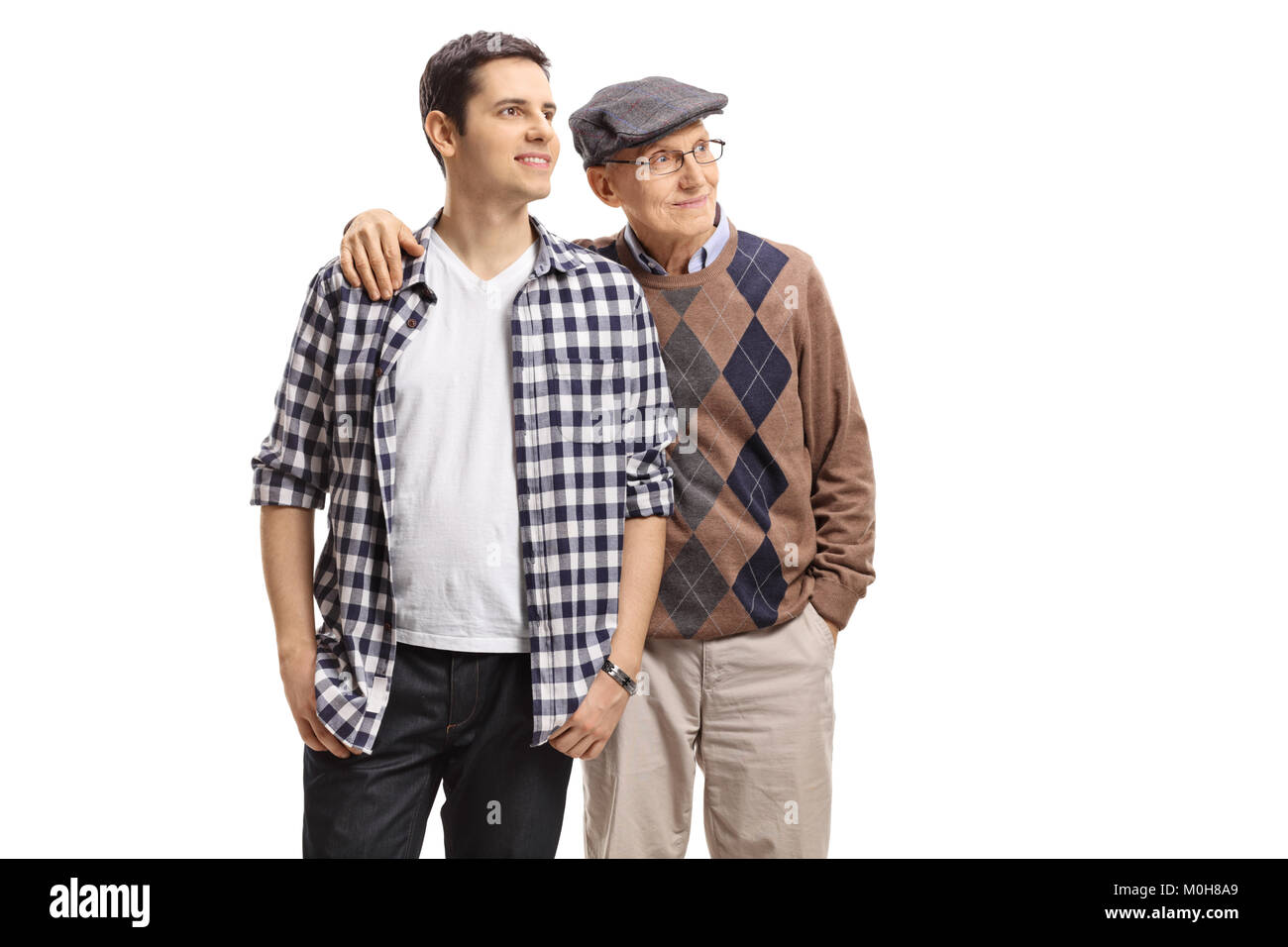 Young guy and an elderly man looking away isolated on white background Stock Photo