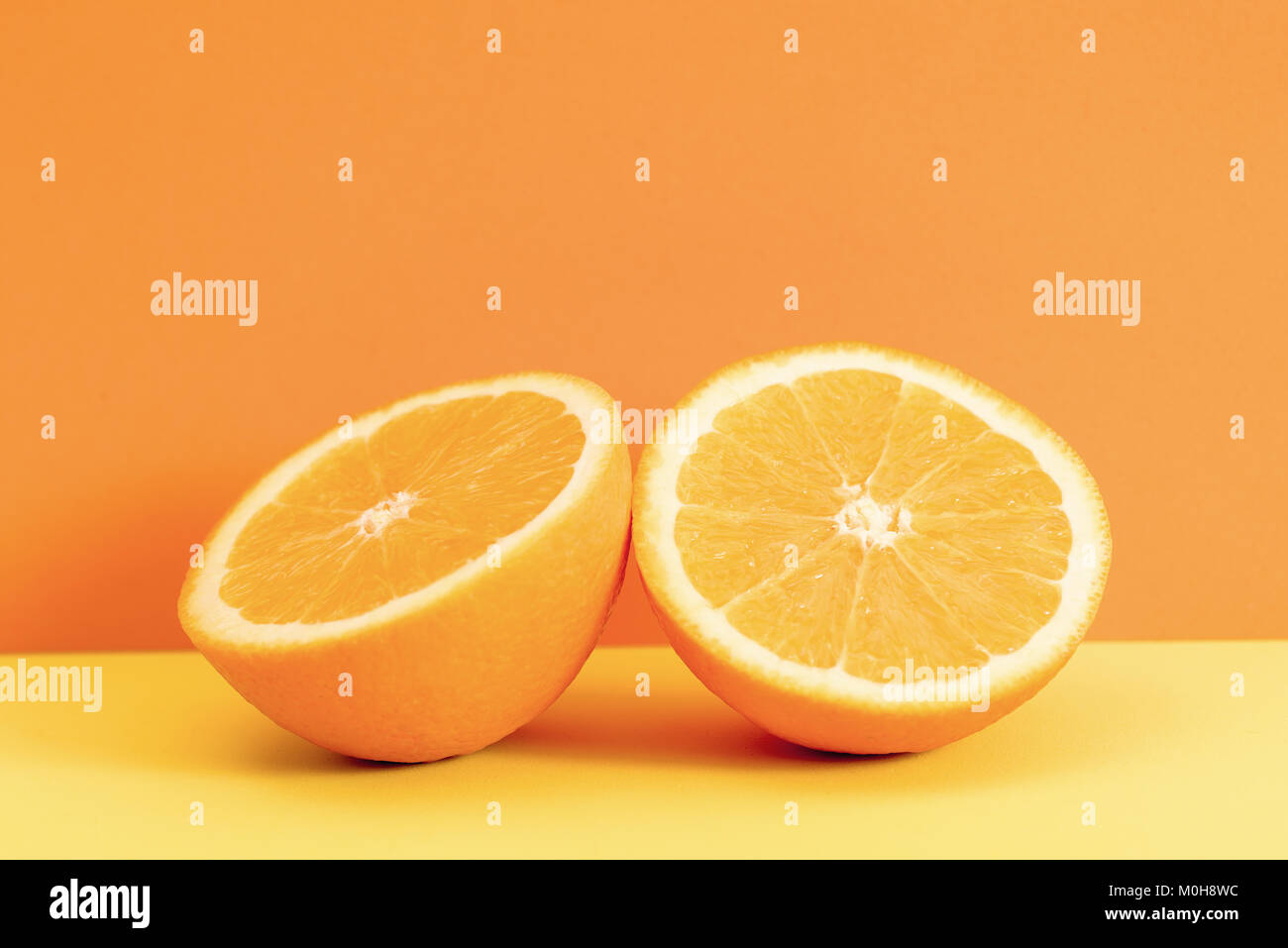 Fresh orange slice isolated on orange background Stock Photo - Alamy