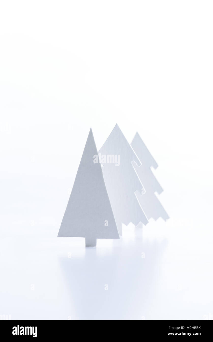 white paper christmas trees, isolated on white Stock Photo - Alamy