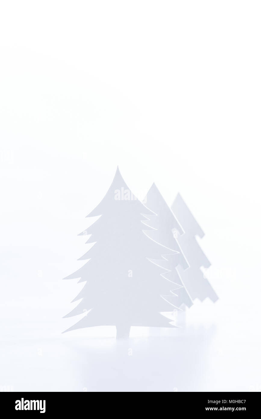 white paper christmas trees, isolated on white Stock Photo - Alamy