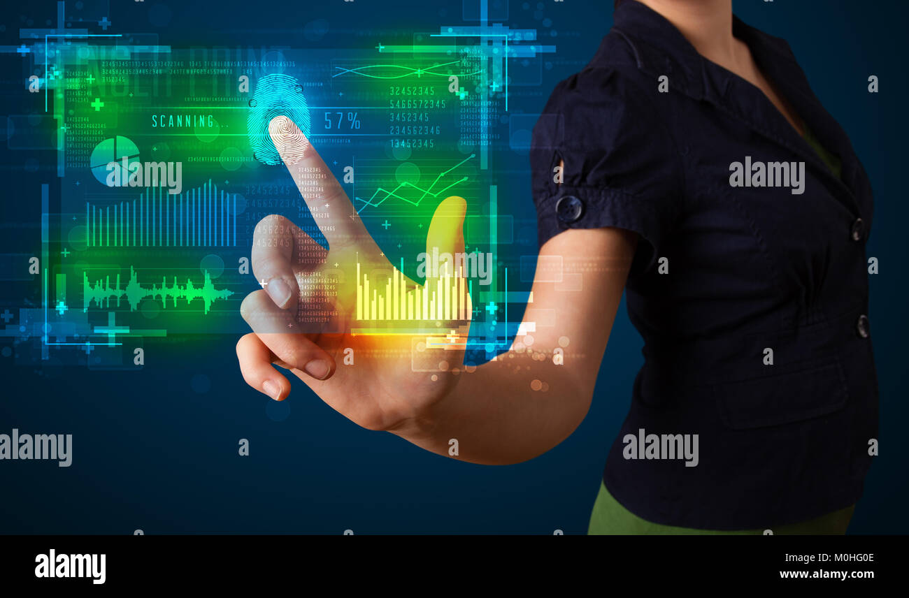 Businesswoman pressing modern technology panel with finger print reader Stock Photo