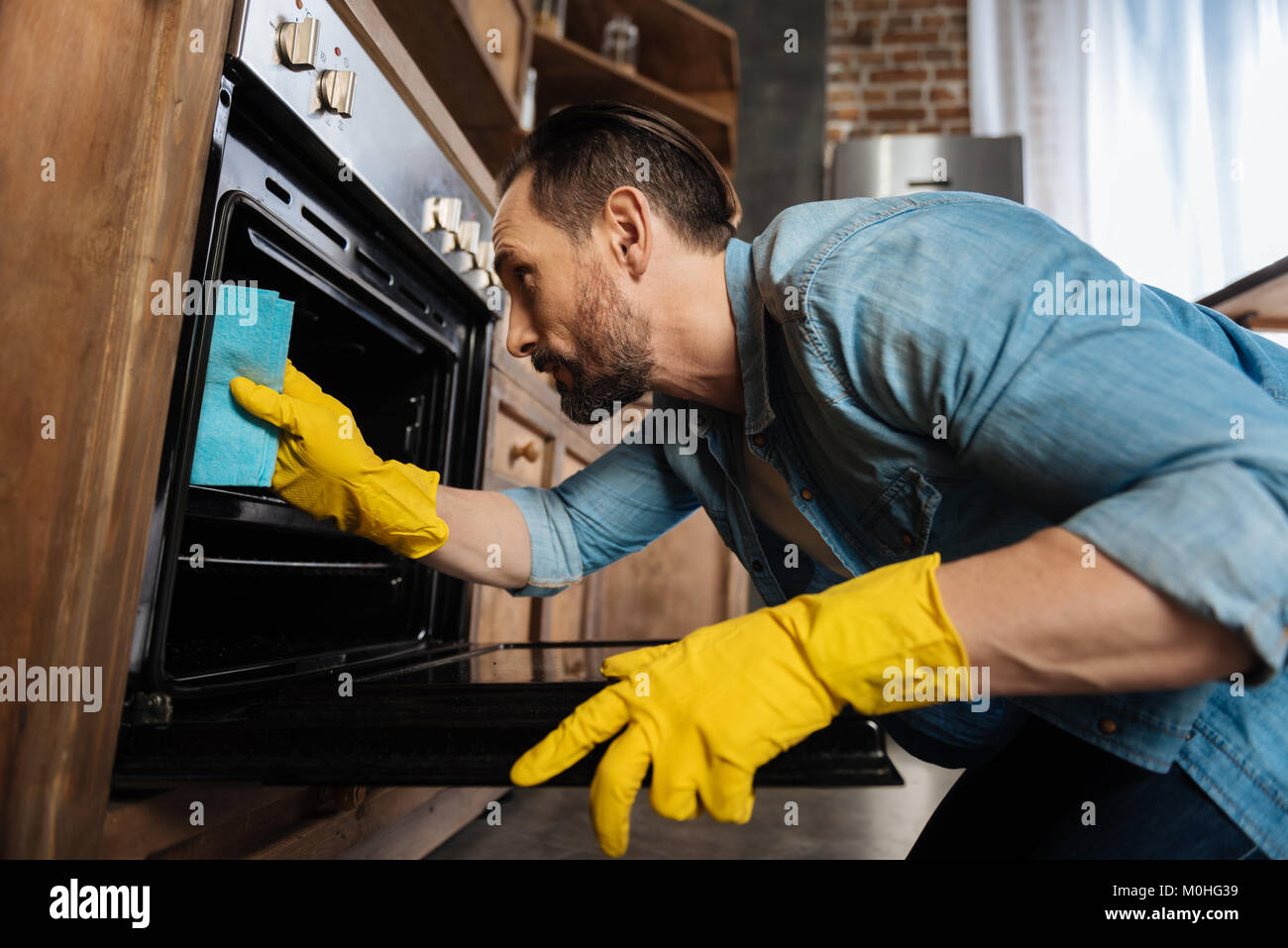 Concentrated male cleaner removing grease Stock Photo