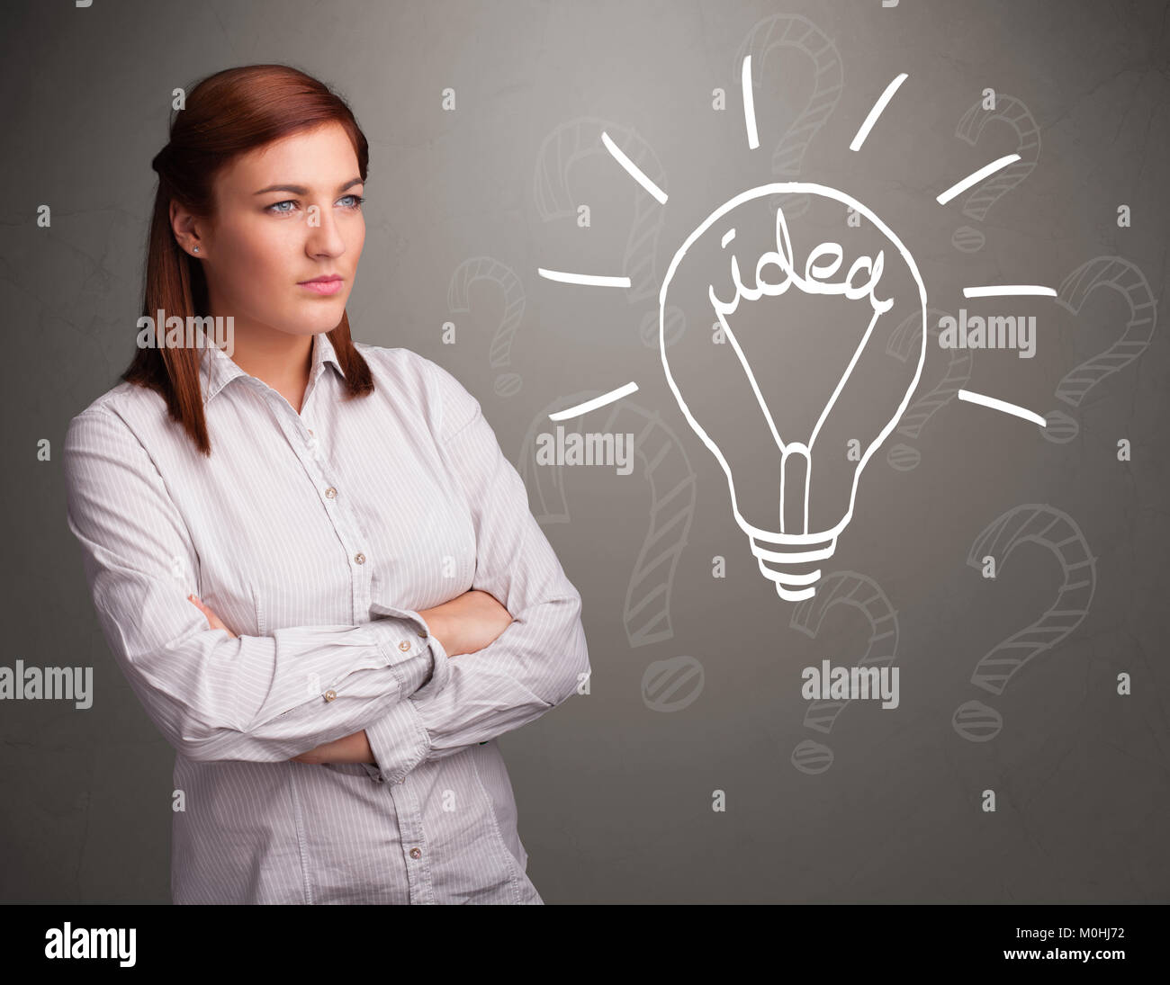 Pretty young girl comming up with a light bubl idea sign Stock Photo