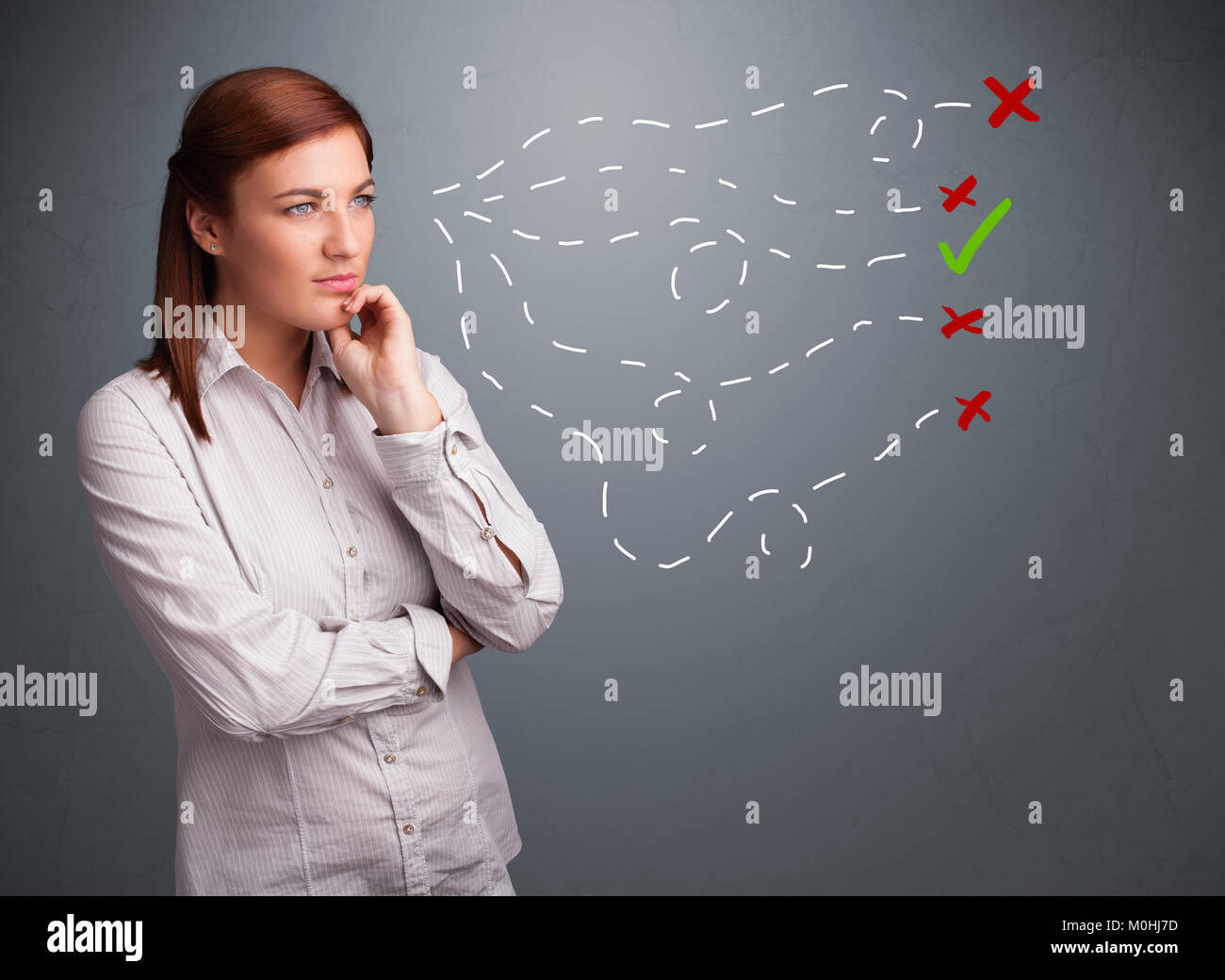 Beautiful young woman choosing between right and wrong signs Stock Photo