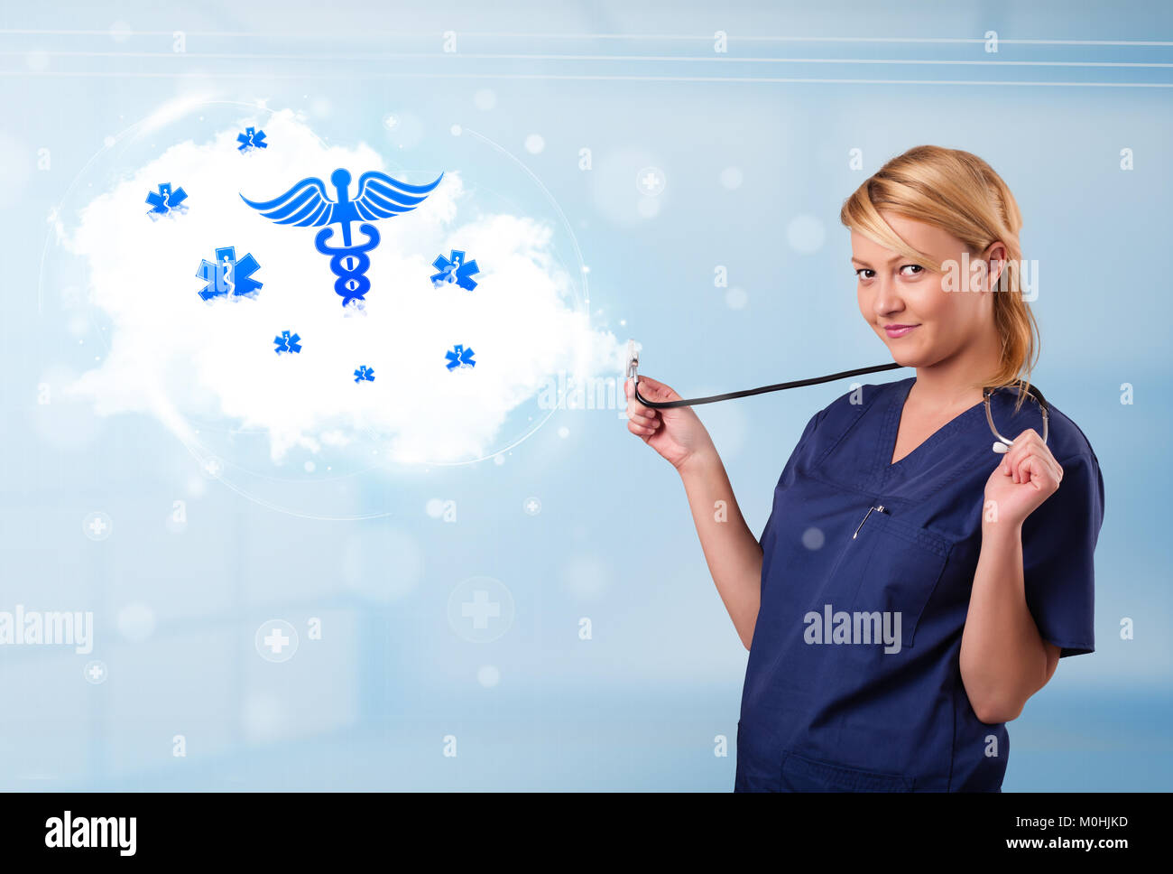 Beautiful young doctor with abstract cloud and medical icons Stock