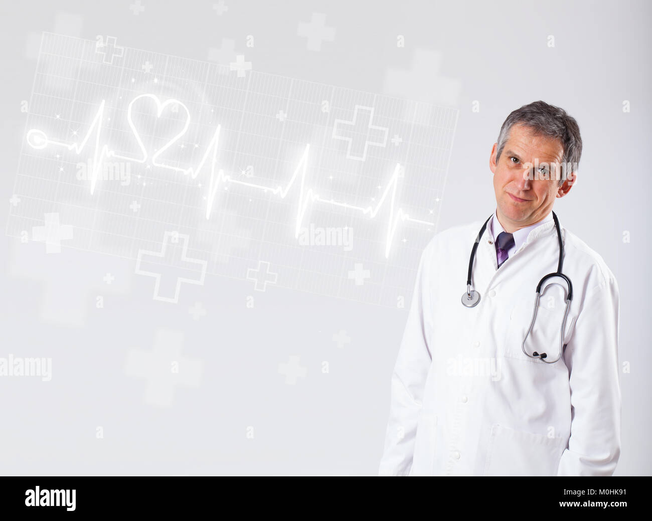 Proffesional doctor examinates heartbeat with abstract heart Stock Photo