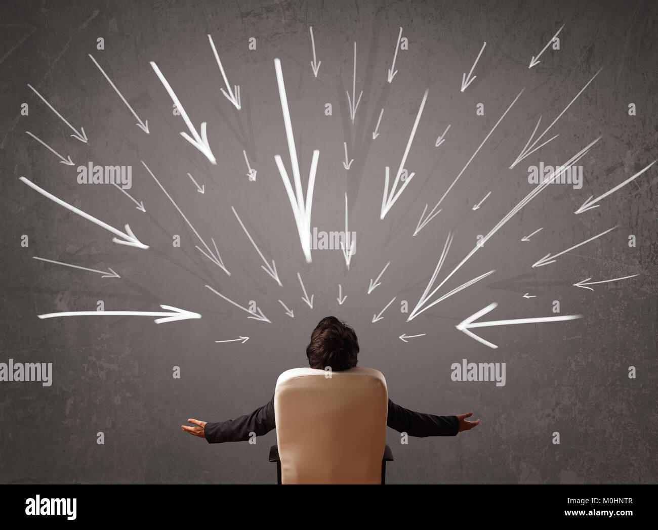 Business man with hand drawn arrows pointing at his head concept Stock