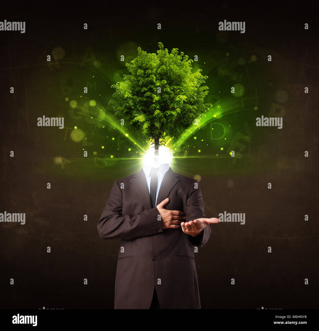 Man with green tree head concept on brown background Stock Photo