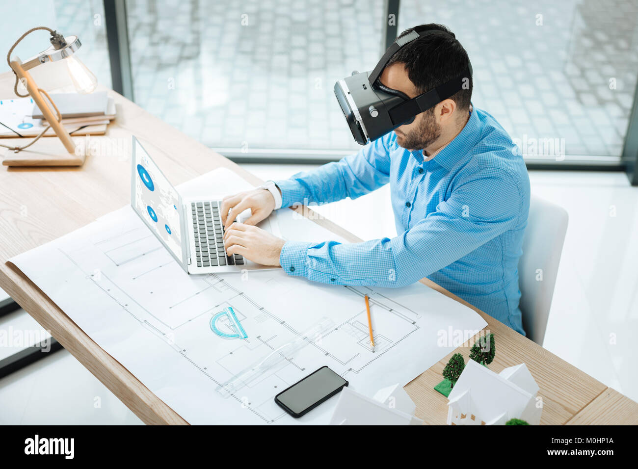 Top view of architect in VR headset working on laptop Stock Photo Alamy