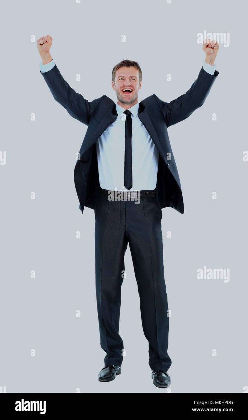 Excited handsome business man with arms raised in success Stock Photo ...