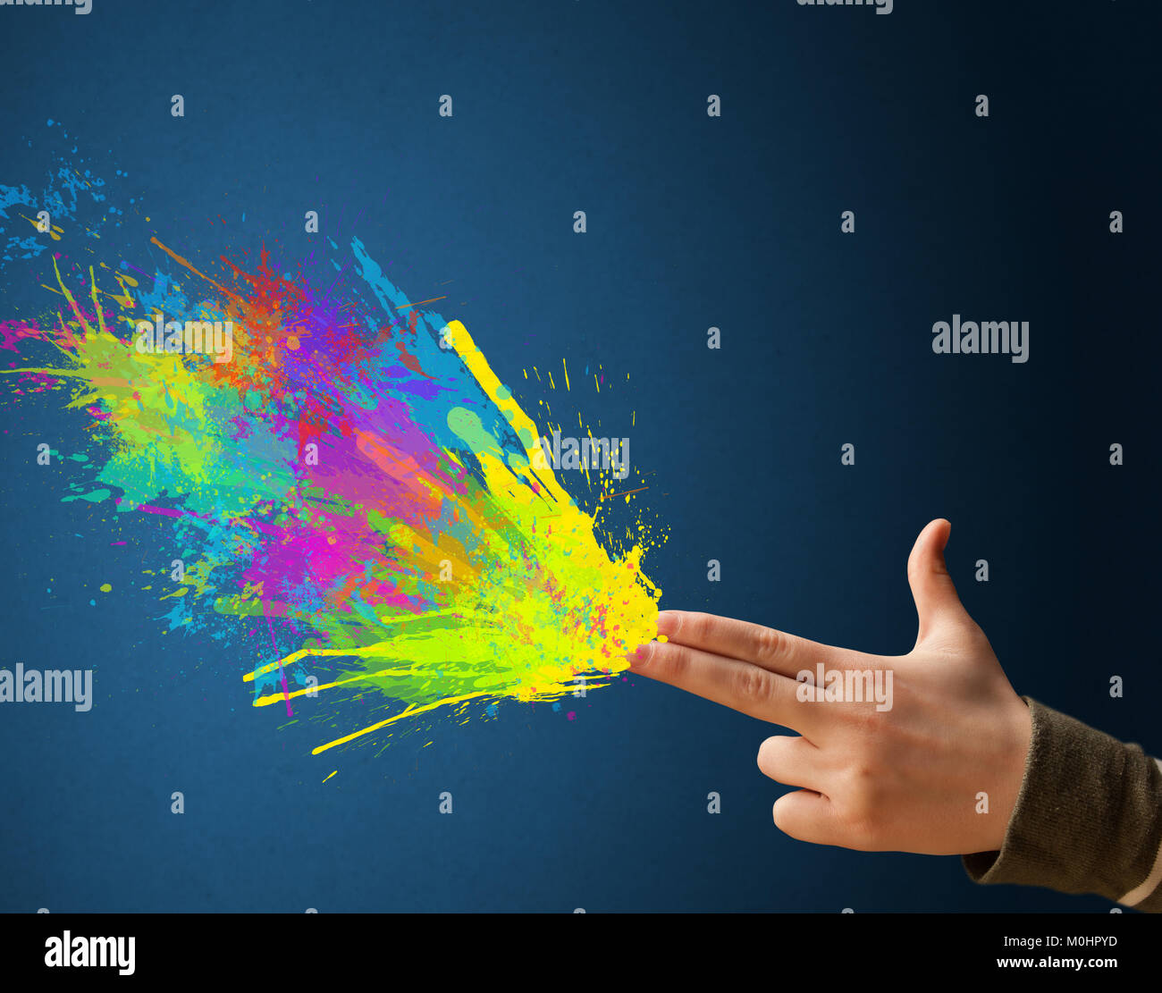 Colored splashes are coming out of gun shaped hands Stock Photo - Alamy