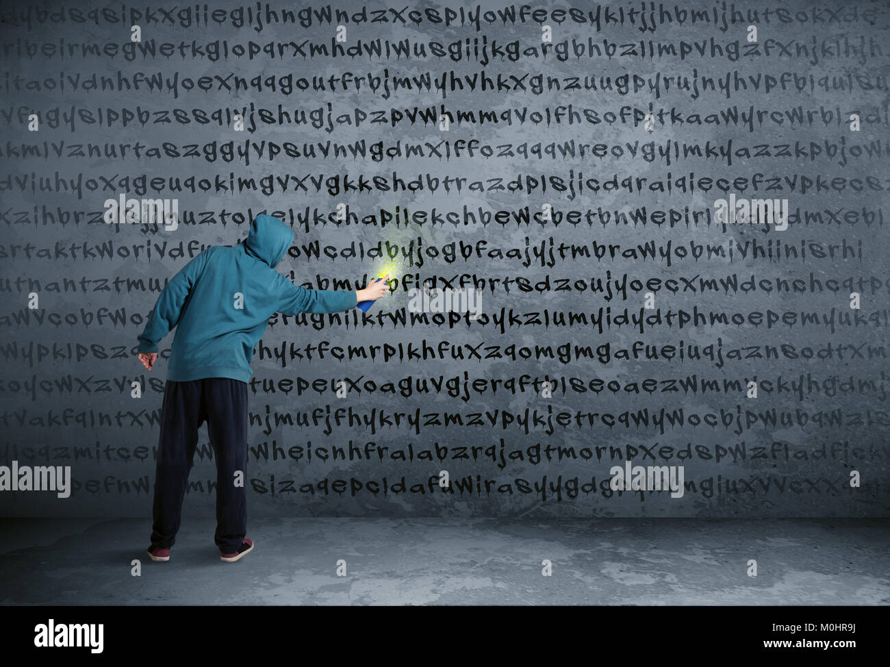 Young urban painter drawing random letters on the wall Stock Photo - Alamy
