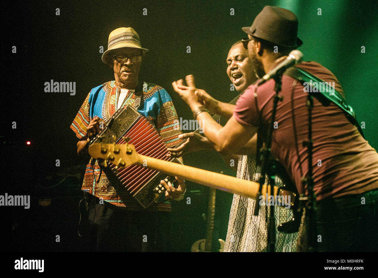 Cape Verde-musician and accordionist Victor Tavares is better known as Bitori and for the forbidden dance music from the island Funana, Cape Verde. Here Victor “Bitori” Tavares (L) is seen live on stage with singer Chando Graciosa and bass player Danilo Tavares at a live concert at Global in Copenhagen. Denmark, 14/10 2016. Stock Photo