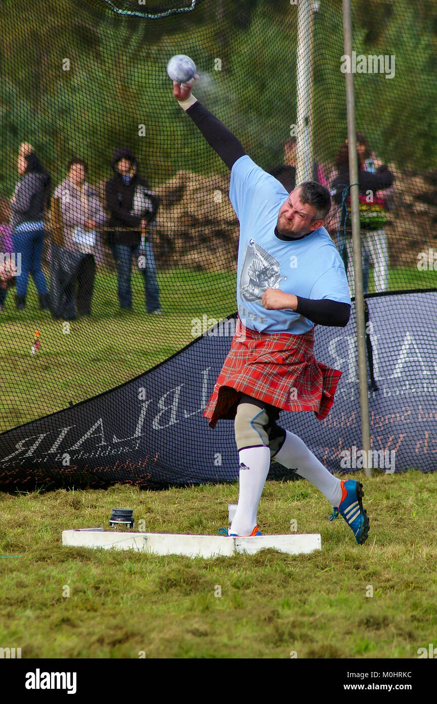 Bonar Bridge, Scotland - September 20th, 2014 - Shot putter wearing a traditional Scottish Kilt competing in the Highland Games Stock Photo